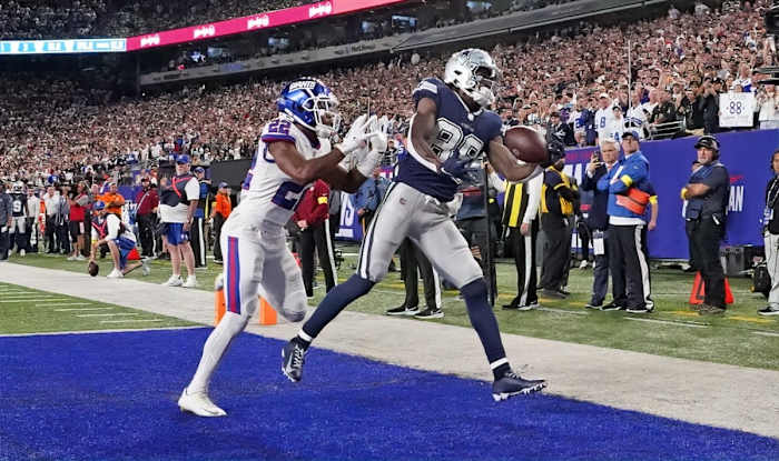 Sep 26, 2022; East Rutherford, NJ, USA; Dallas Cowboys wide receiver CeeDee Lamb (88) makes a touchdown catch over New York Giants cornerback Adoree' Jackson (22) during the second half at MetLife Stadium.